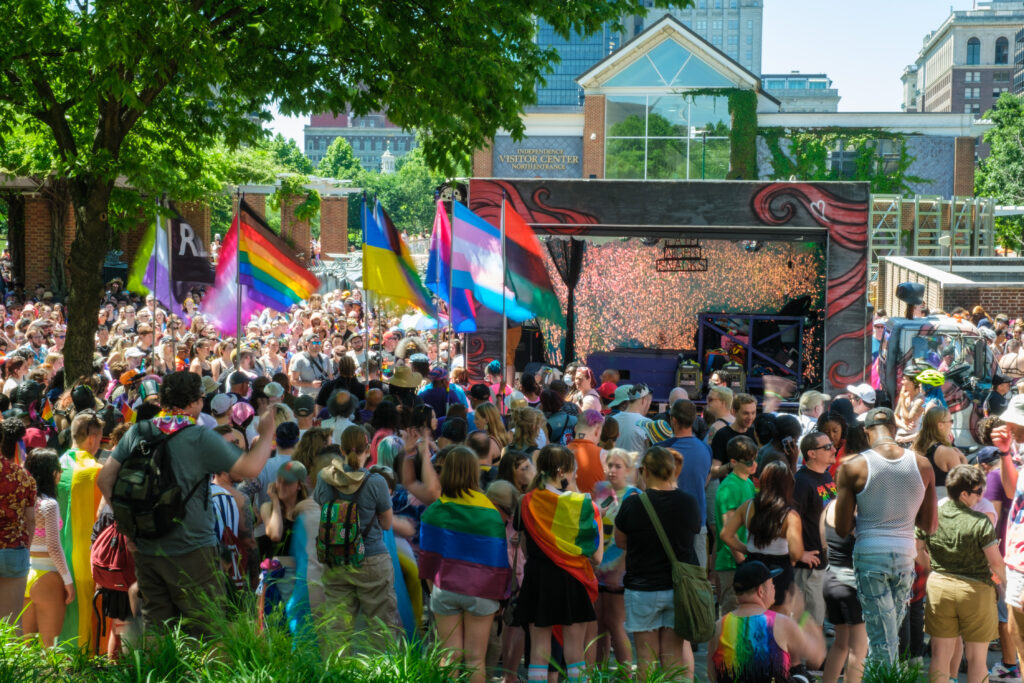 An image of the Beardmobile box truck at Philadelphia pride. Surrounded by a crowd of people carrying various pride flags.